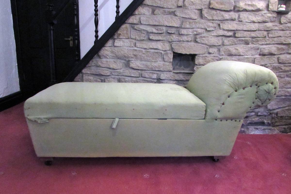 Victorian chaise longue before restoration in worn green fabric