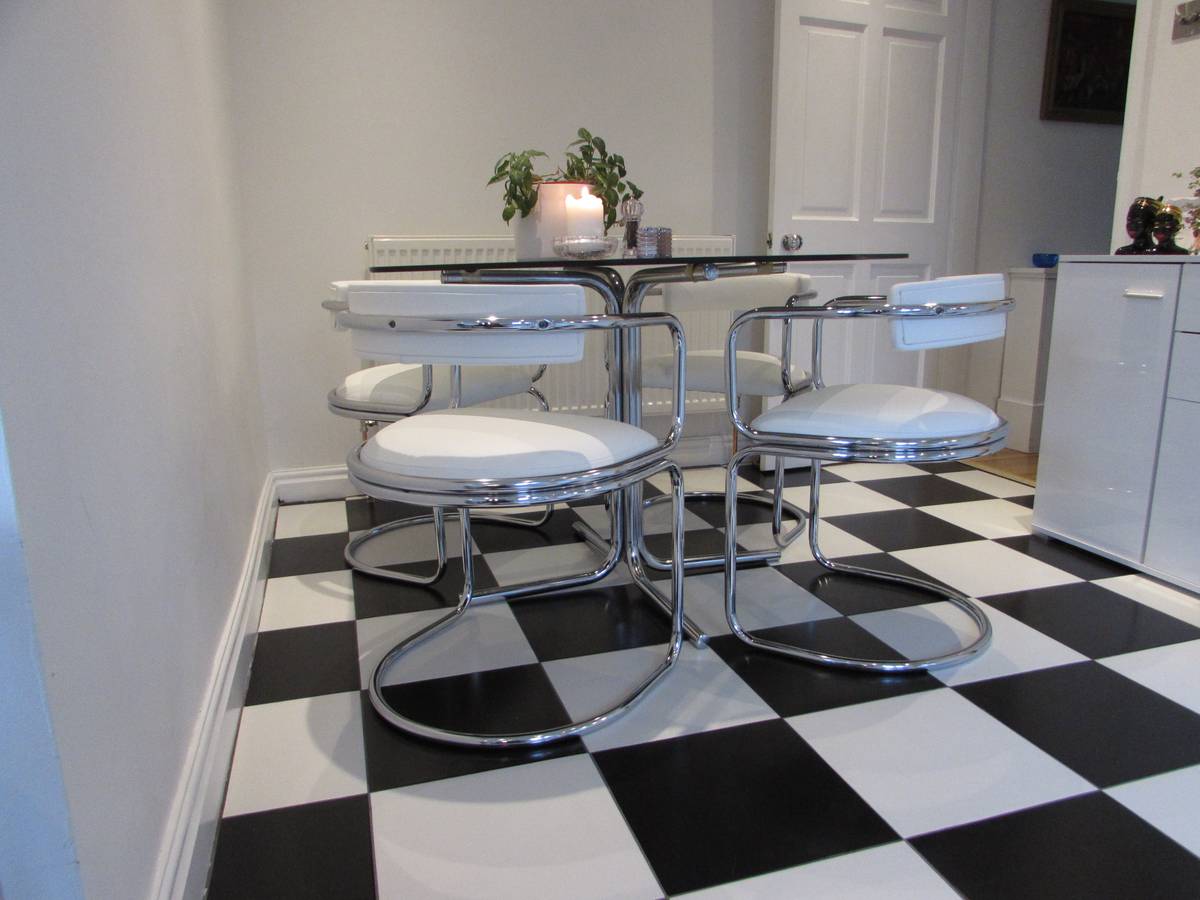 Retro chrome cantilever dining chairs reupholstered in white leather