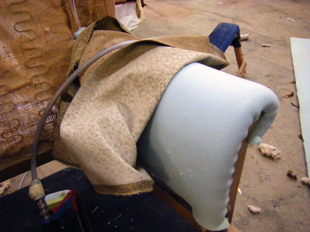 Arm being repadded with new foam