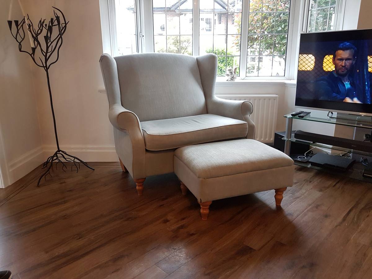 Wingback loveseat and ottoman in cream fabric before re-cover